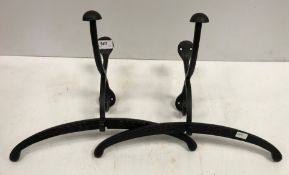 A pair of modern painted cast metal hat and coat hooks inscribed "Hotel Paris"