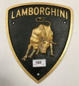 A painted cast metal "Lamborghini" sign