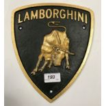 A painted cast metal "Lamborghini" sign