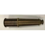 A modern reproduction brass four draw telescope inscribed "Broadhurst Clarkson & Co.