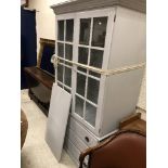 A modern painted cabinet on chest, the glazed top,