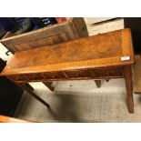 A walnut side table in the early 18th Century manner,