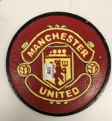 A modern painted cast metal sign "Manchester United"