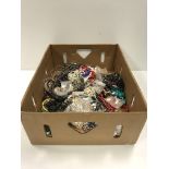 A box of assorted modern costume jewellery to include various beaded necklaces, chains,