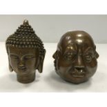 A modern bronze of a Sino Tibetan Buddha head and a bronze paperweight as a four-faced head.