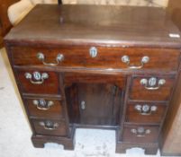 A George III mahogany kneehole desk,