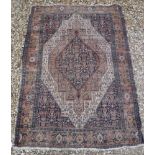 A Caucasian rug with blue stylised medallion decorated lozenge shaped medallion on a fawn / cream