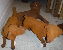 Three cast iron dogs.