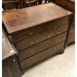 A 19th Century oak chest of two short over three long graduated drawers, raised on bracket feet,