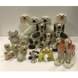 A collection of Victorian Staffordshire Spaniels,