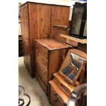 A pair of modern pine chests of five long drawers, together with a matching three-drawer chest,