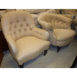 A Victorian button back salon chair raised on turned and ringed legs,