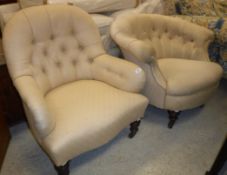 A Victorian button back salon chair raised on turned and ringed legs,