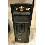 A Victorian black painted cast iron letter box inscribed "VR" and "Post Office" to top