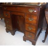 A late George III mahogany kneehole desk,