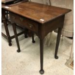 A late George III oak single drawer side table on turned tapering legs to pad feet,