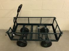 A 37" x 20" metal twin axle garden trolley