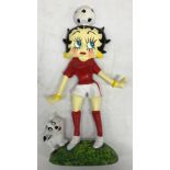 A modern painted cast iron doorstop "Betty Boo Playing Football"