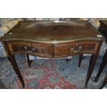 An early 20th Century mahogany serpentine fronted side table in the George III taste,