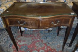 An early 20th Century mahogany serpentine fronted side table in the George III taste,