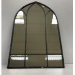 A painted metal Gothic arch frame mirror,