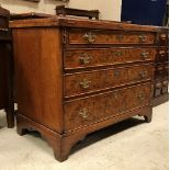 A burr walnut bachelor's chest in the early 18th Century manner, the fold-over top quartered,