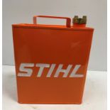 A modern painted metal fuel can inscribed "Stihl"