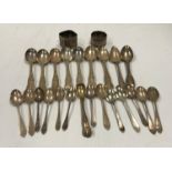 A collection of various silver teaspoons and two napkin rings,