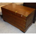 A 19th Century brass bound teak military style trunk with interior of various pull-out drawers,