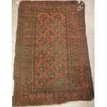 A Bokhara rug with all over elephant foot medallions on a red ground,