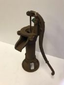 A cast iron garden pump in the Victorian manner,