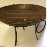 A large iron fire pit on stand,