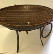 A large iron fire pit on stand,