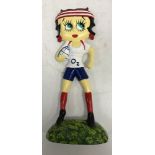 A modern painted cast iron doorstop "Betty Boo Playing Rugby"