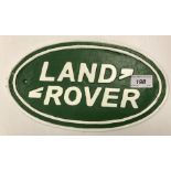 A painted cast metal "Landrover" sign