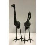 Two modern verdigris patinated bronze crane figures