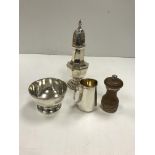 A collection of silver wares comprising an octagonal faceted baluster shaped sugar caster,