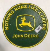 A painted cast metal sign "Nothing Runs a Deere - John Deere"