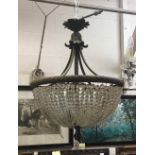 A large 19th Century French gilt bronze ceiling light of basket form strung with facetted glass
