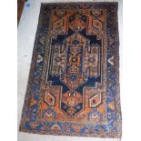 A Persian rug with architectural style centre medallion on a blue ground,