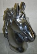 A polished aluminium horse head ornament 45cm high