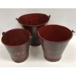 A graduated set of three vintage style painted metal buckets inscribed "Coca Cola"
