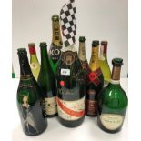 A collection of various vintage Champagne / wine bottles including a Moet et Chandon signed by