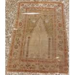 A Turkish silk prayer rug with centre architectural medallion on a pale green ground,