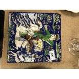 A 19th Century Persian tile of a mounted archer CONDITION REPORTS Some cracking to