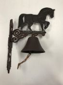 A painted cast metal "Heavy Horse" bell
