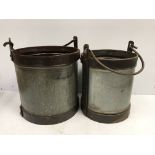 Two large galvanised and studded steel swing handled buckets
