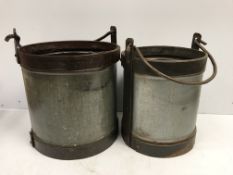 Two large galvanised and studded steel swing handled buckets