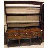 A circa 1780 oak dresser with two tier plate rack above a plain top, three drawers to undertier,