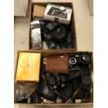 Two boxes of assorted camera equipment, binoculars, camera cases, lenses,